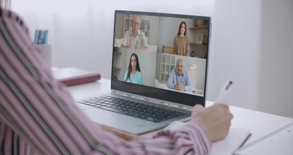 Female Student Makes Conference Video Call on Laptop Computer Talks with Web Tutor, Online Teacher alt