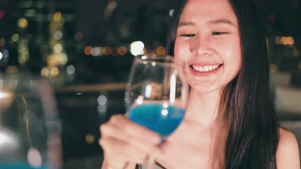 Young asian woman with sparklers is dancing and celebrating a new year alt