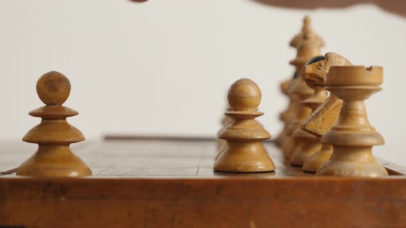 White player pawn moving over chequered fields 4K 2160p 30fps UltraHD footage - Old chess set figure alt