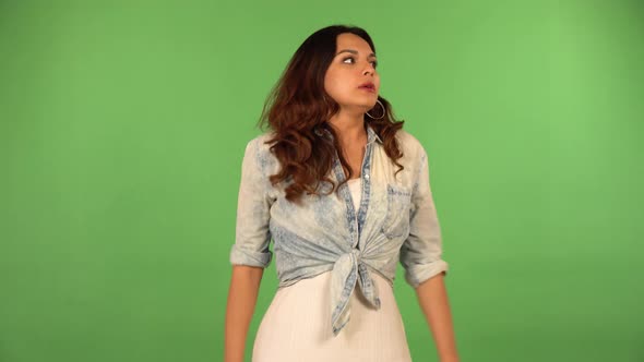 A Young Beautiful Caucasian Woman Acts Angry  Green Screen Background