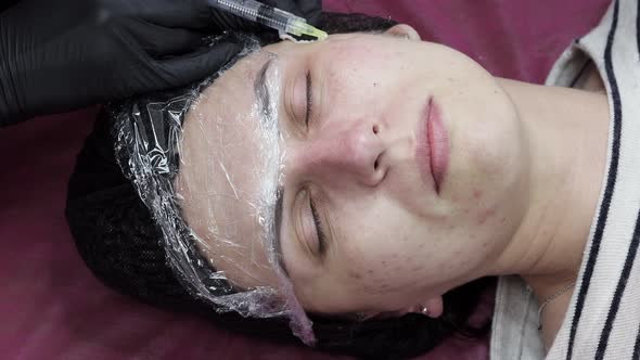 Face mesotherapy procedure in a beauty salon. Beautician doctor makes injections alt