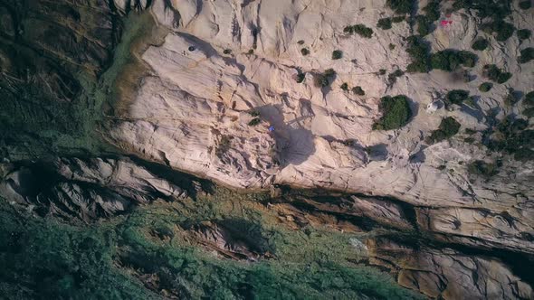 Man on rocky beach aerial shot