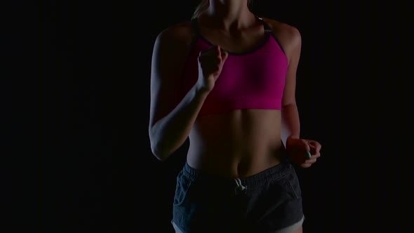 Girl with Hair in the Tail Runs on a Black Screen. Slow Motion. Close Up alt