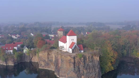 Church Overlooking a Small Lake on a Foggy Morning in Germany alt