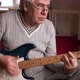 Senior Man is Playing Guitar - VideoHive Item for Sale