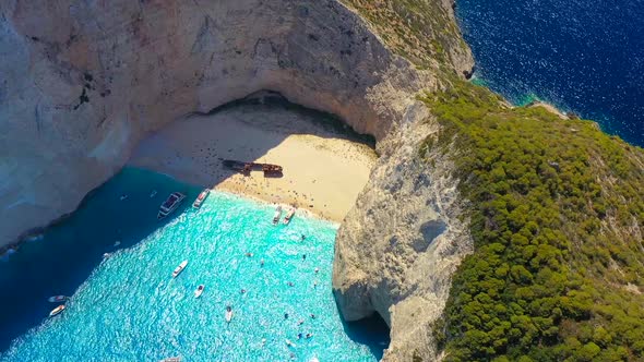 View of Navagio beach, Zakynthos Island, Greece. Aerial landscape. Azure sea water. Rocks and sea. alt