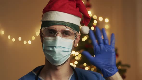 Doctor greets with Christmas tree alt