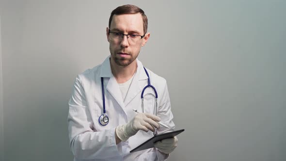 Doctor Using Tablet