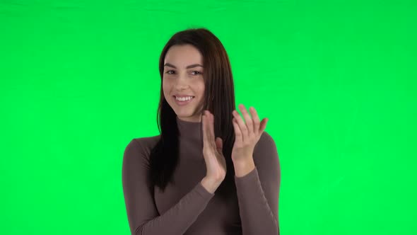 Attractive Girl Claps Her Hands with Wow Happy Joy and Delight. Green Screen alt