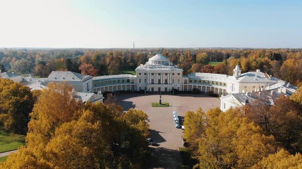 Aerial View of the Pavlovsky Castle in the Autumn Park with Yellow and Orange Trees alt