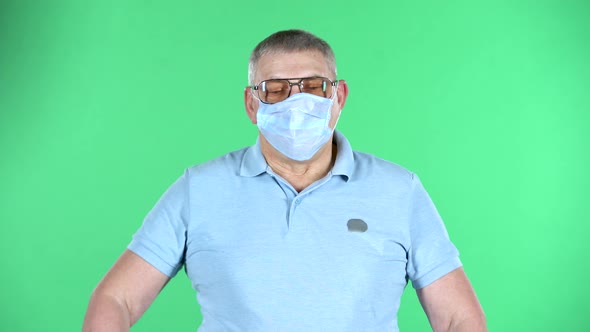 Portrait of Aged Man Takes Off His Medical Disposable Mask and Takes a Deep Breat, Isolated Over alt