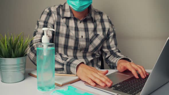 Man Clean Hands with Alchohol Gel to Protect Against Coronavirus or COVID19 alt