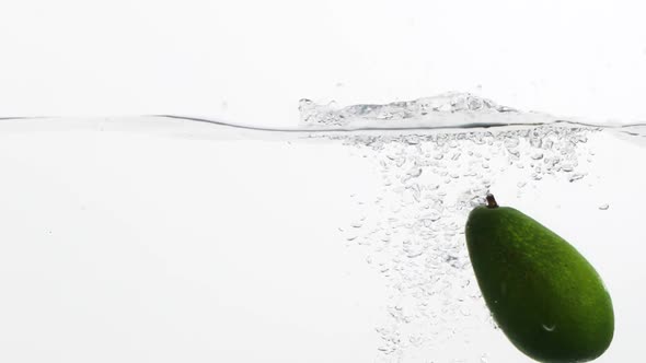 Avocado Falling into a Water