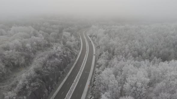 Empty Highway Foggy Winter Landscape Aerial Pull Back