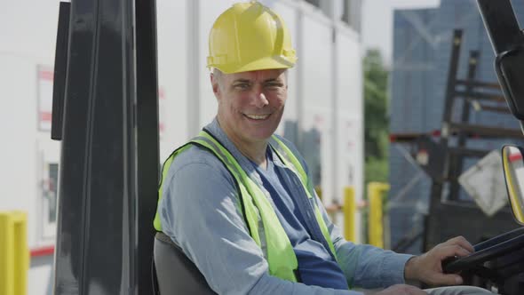 Portrait of forklift operator at shipping facility.  Fully released for commercial use.