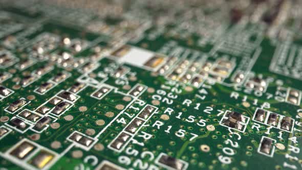 Extreme Closeup of Green Printed Circuit Board Electronics Shot with Dolly alt