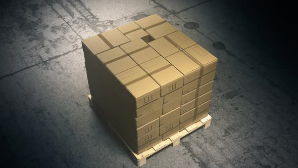 A stack of cardboard boxes on a pallet in the warehouse waiting for a forklift. alt