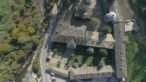 Spin aerial: fly over to Troyan Monastery in Bulgaria in the middle of the vegetation alt