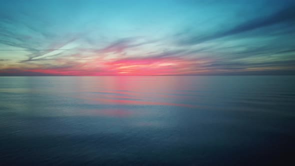 Aerial Drone Shoot. Sunrise Over the Sea. Colorful Sunset on the Baltic Sea, Latvia.4K Video alt