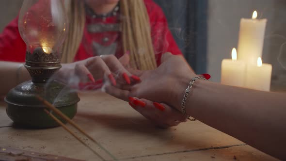 Close-up of Hand Reader Explaining Lines on Male Palm alt