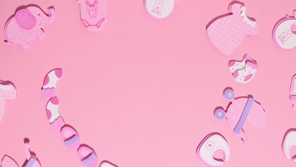 Funny Pink Stickers Symbolizing a Newborn Girl Appear on a Pink Background alt