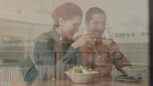 Man and Woman Having Dinner in Restaurant alt