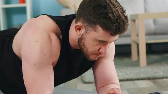 Athletic Man Is Standing In Plank alt
