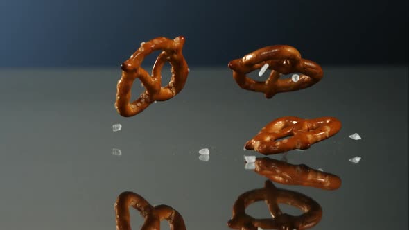 Pretzels falling and bouncing in ultra slow mo 1500fps - reflective surface - PRETZELS PHANTOM  alt