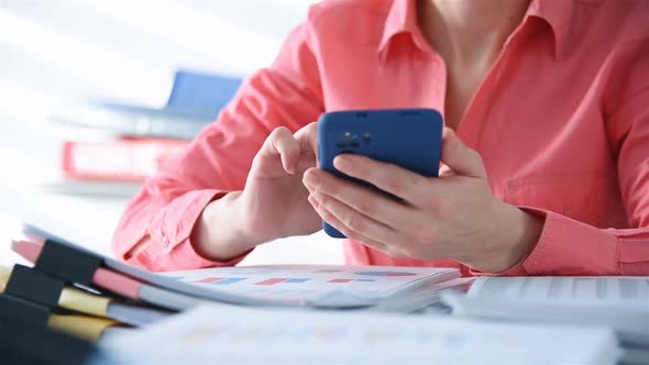 Accountant Businesswoman Calculating Tax Data  On Mobile Phone