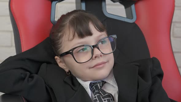 A business child thinks about the future.  alt