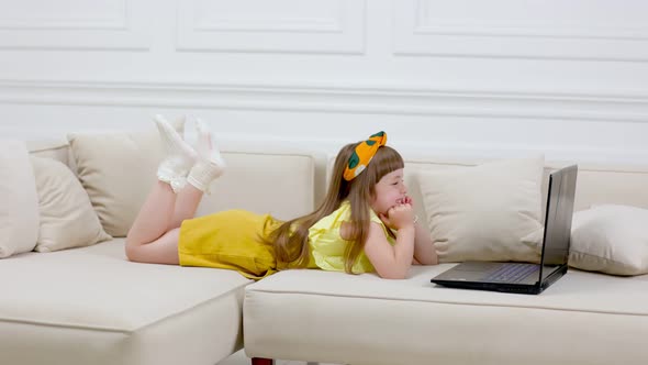 Rebecque Looking at Laptop alt