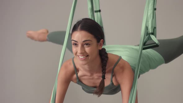Adorable Woman Yoga Trainer During Aerial Yoga Master Class 