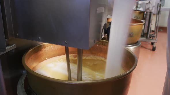 Mixing ingredients for chocolate fudge at candy factory