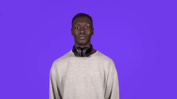 Clapping Young African Man Applauding in Respect to Someone alt