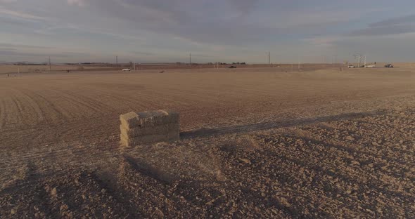 Hay bail stack in a field. alt