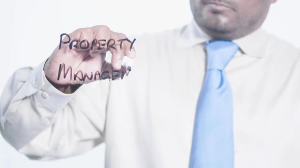 Asian Businessman Writes Property Management