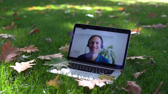 Laptop with Video in Leaves Autumn