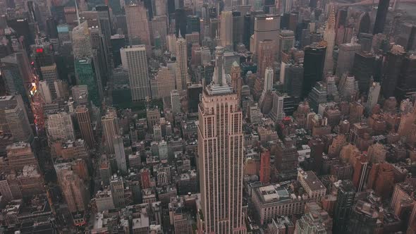 AERIAL: Close Up of Empire State Building with Midtown Manhattan, Times Square in the Background at alt