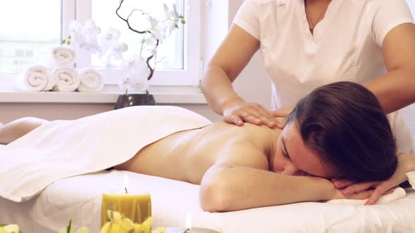 Woman Receives Body Massage at Spa Salon