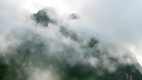 Morning clouds over mountains at sunrise