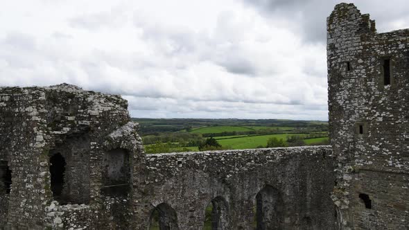 Llawhaden castle ruins, Pembrokeshire in Wales, UK. Aerial pedestal down alt