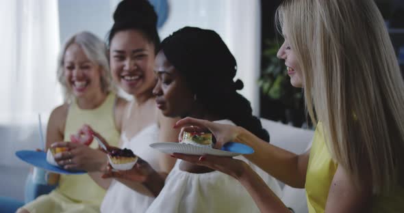 Friends Eating Dessert While Celebrating Young Mother alt