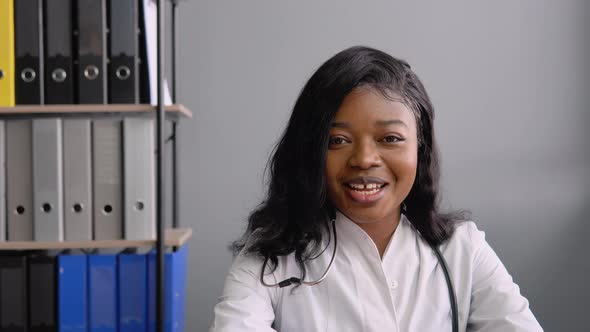 Young African American Female Doctor Make Online Video Call Consult Patient alt