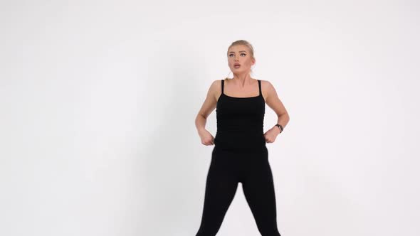 Sexy girl doing fitness exercises. Shooting in the studio on a white background alt