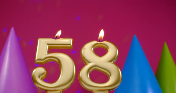 Burning Birthday Cake Candle Number 58
