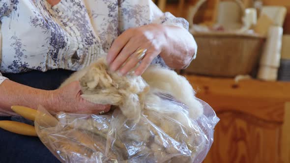 Senior woman sorting the wool 4K 4k alt