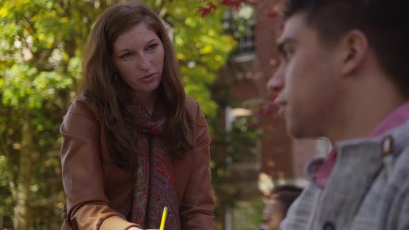 College students on campus meet in courtyard