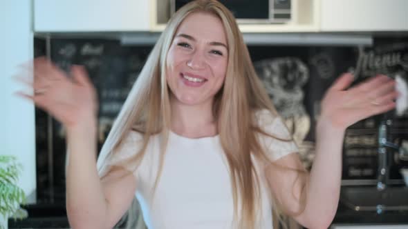 Businesswoman Looking at Camera Working at Home alt