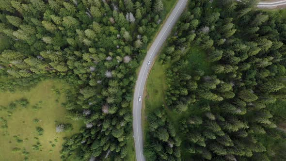 Drone Shot of Cars Driving on Mountain Road alt