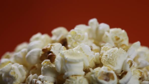 Cooked Popcorn in a Plate on a Orange